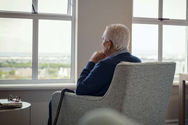 Man Looking Out Of Window